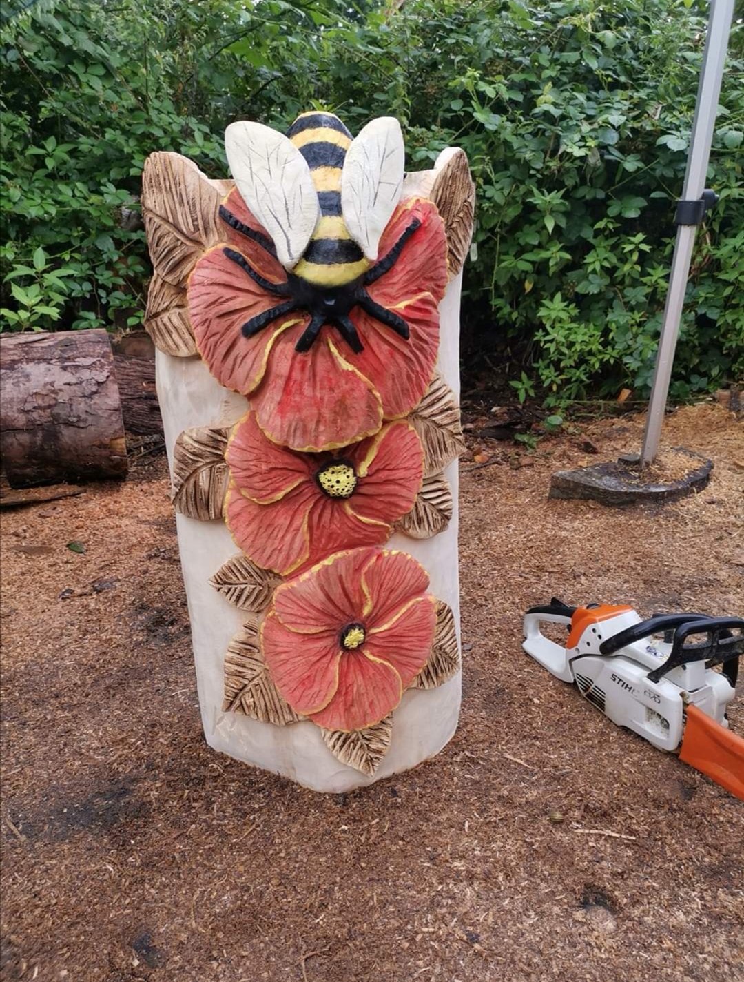 Flowers and bee carving